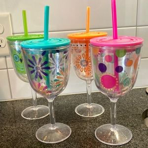 4 Tervis wine goblets with lids and straws.